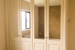 Ivory Raised Panel with Mirror Doors and Panels