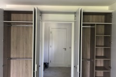 Light Grey Shaker Wardrobes with secret entrance to walk in wardrobe